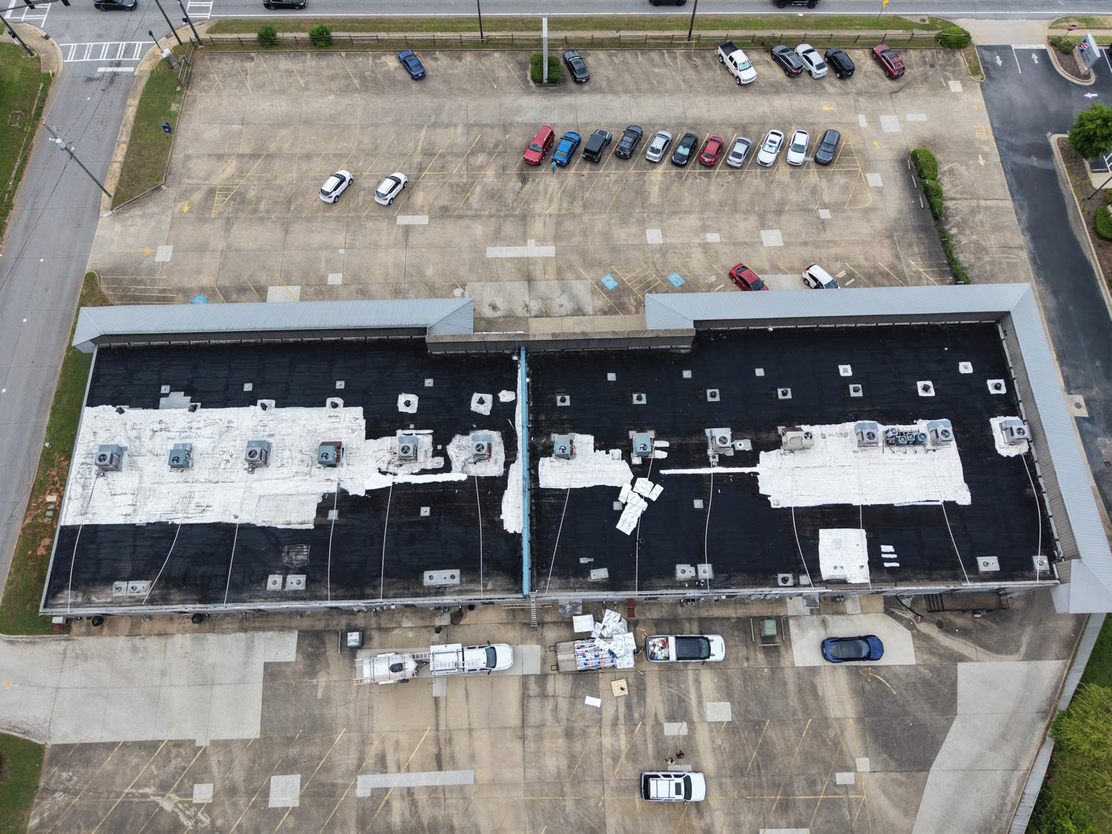 Aerial view of failing black flat roof before TPO replacement in Georgia